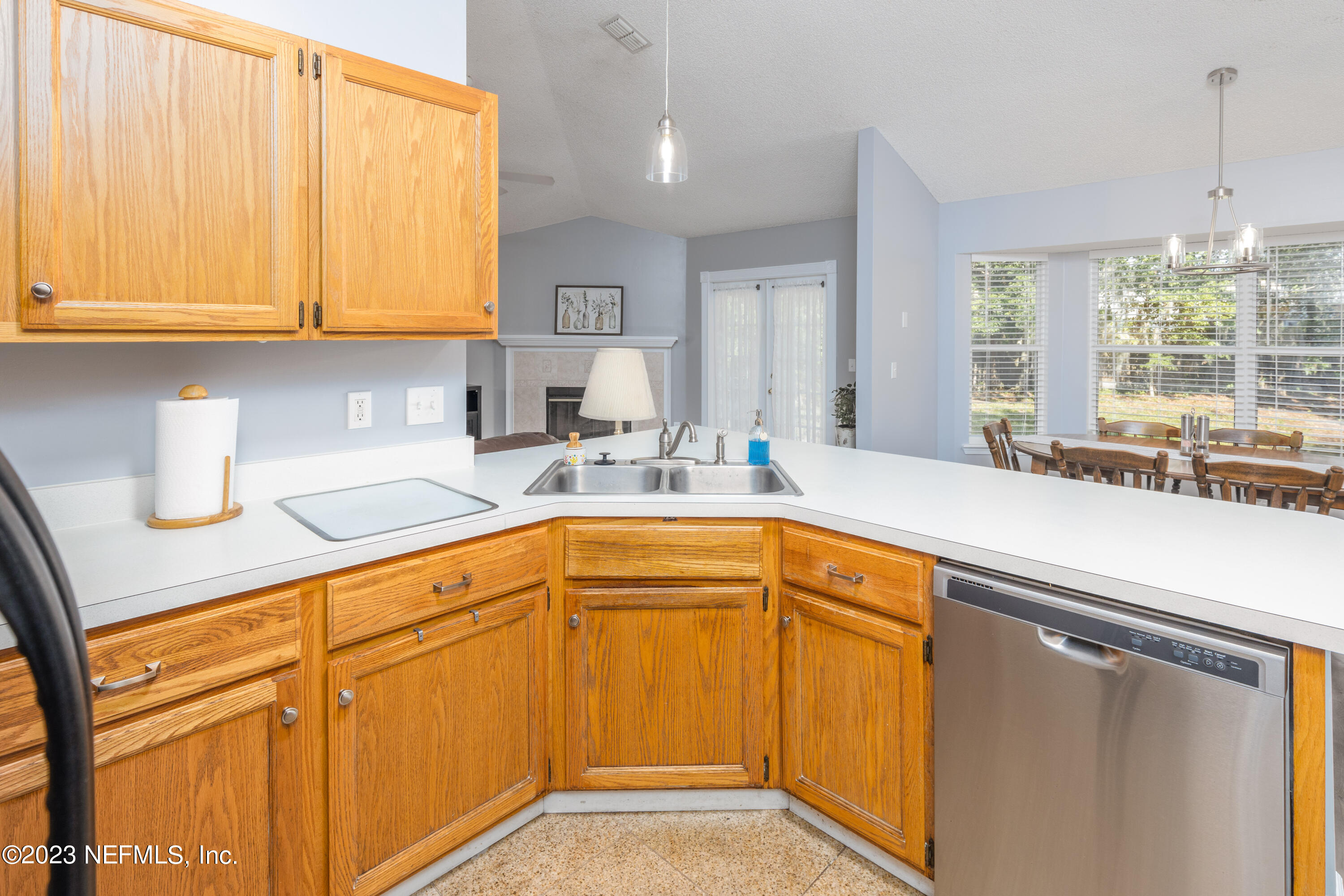 9698 Pritmore Road East Jacksonville, FL 32257 - Photo 9 of 28 a kitchen with stainless steel appliances granite countertop a sink and cabinets