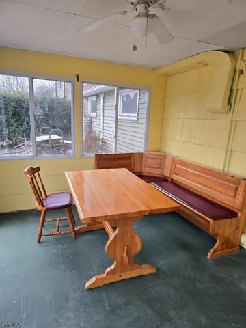 a bedroom with a bed and glass windows