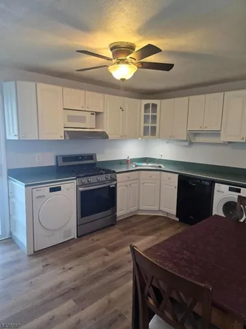 a kitchen with wooden cabinets and sink