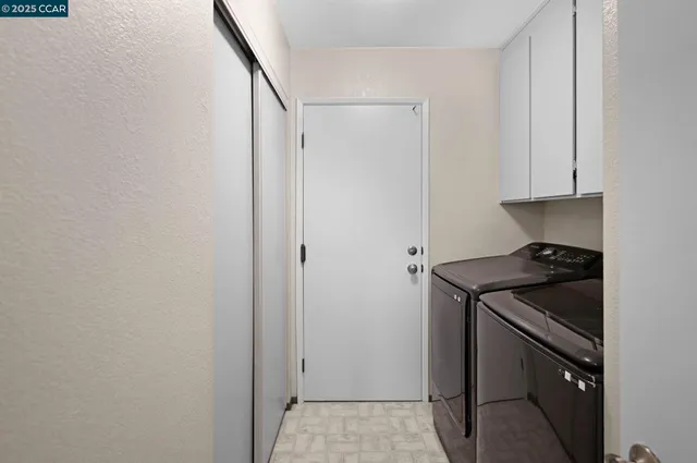 a kitchen with a stove and a refrigerator
