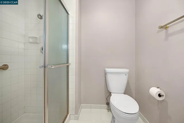 a white toilet sitting next to a bathroom sink