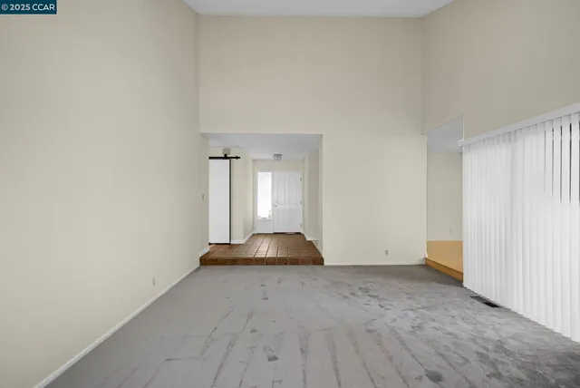 a view of an empty room and window