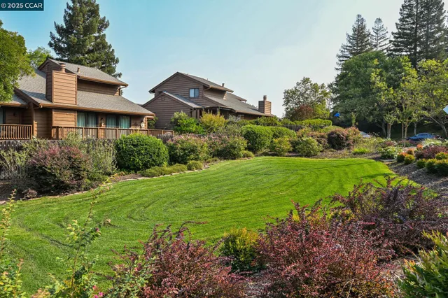 a view of a backyard with sitting area