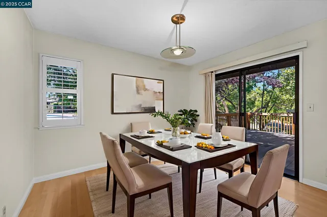 a view of a dining room with furniture window and outside view