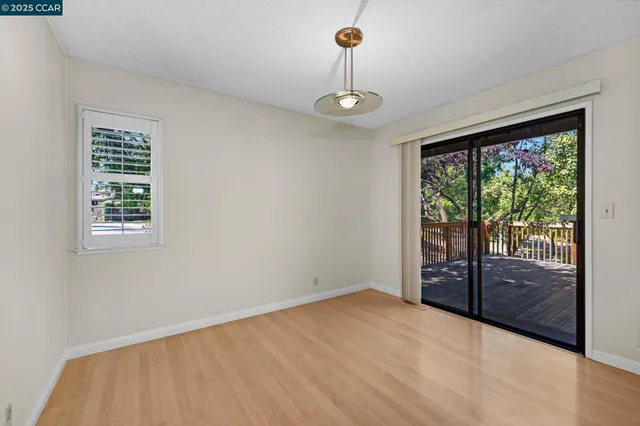 a view of empty room with floor to ceiling window
