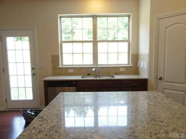 a view of a living room with a large window