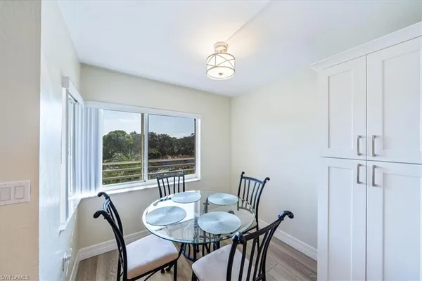a view of a dining room with furniture window and outside view