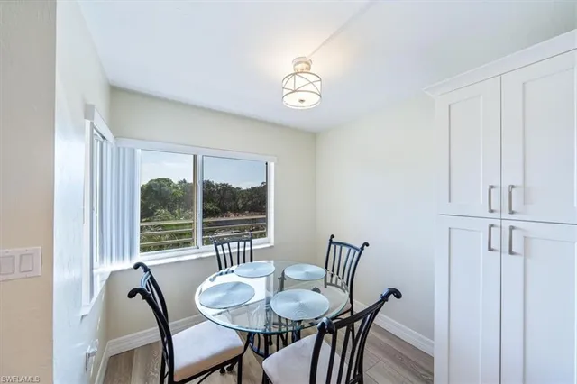 a view of a dining room with furniture window and outside view