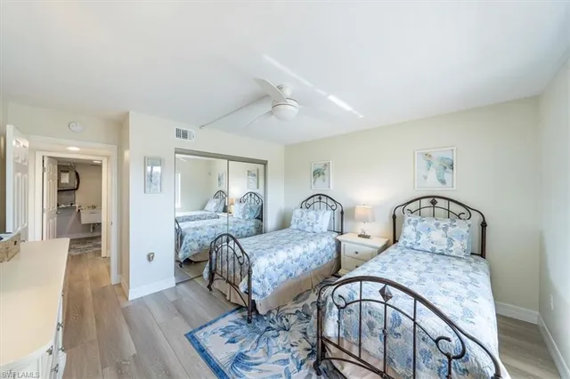 a bedroom with furniture and wooden floor