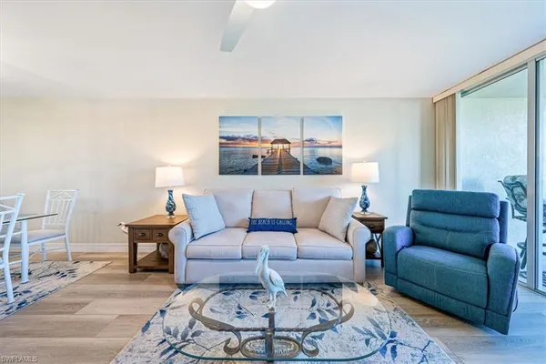 a living room with furniture and a table