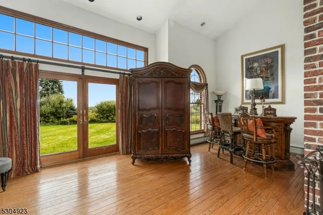 a view of a dining room with furniture and chandelier