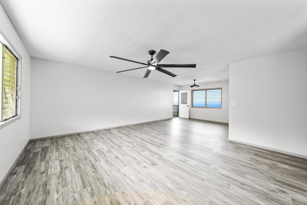 88-2259 Milolii Road Captain Cook, HI 96704 - Photo 15 of 30 wooden floor in an empty room with a window