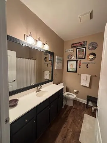 a bathroom with a double vanity sink and mirror