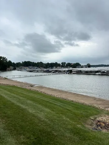a view of a lake with houses in the back