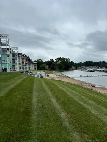 a view of a lake with houses in the back