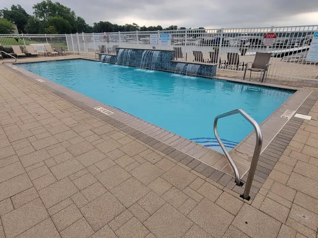 a view of a swimming pool and lounge chair