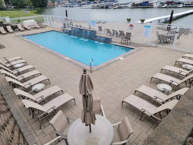 a view of a swimming pool with a lake view