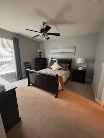 a bed room with a bed and furniture