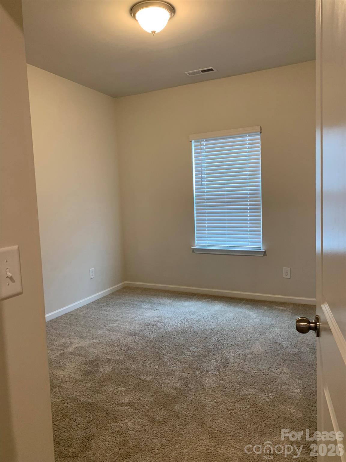 2143 Stevens Mill Road Matthews, NC 28104 - Photo 33 of 39 an empty room with a workbench