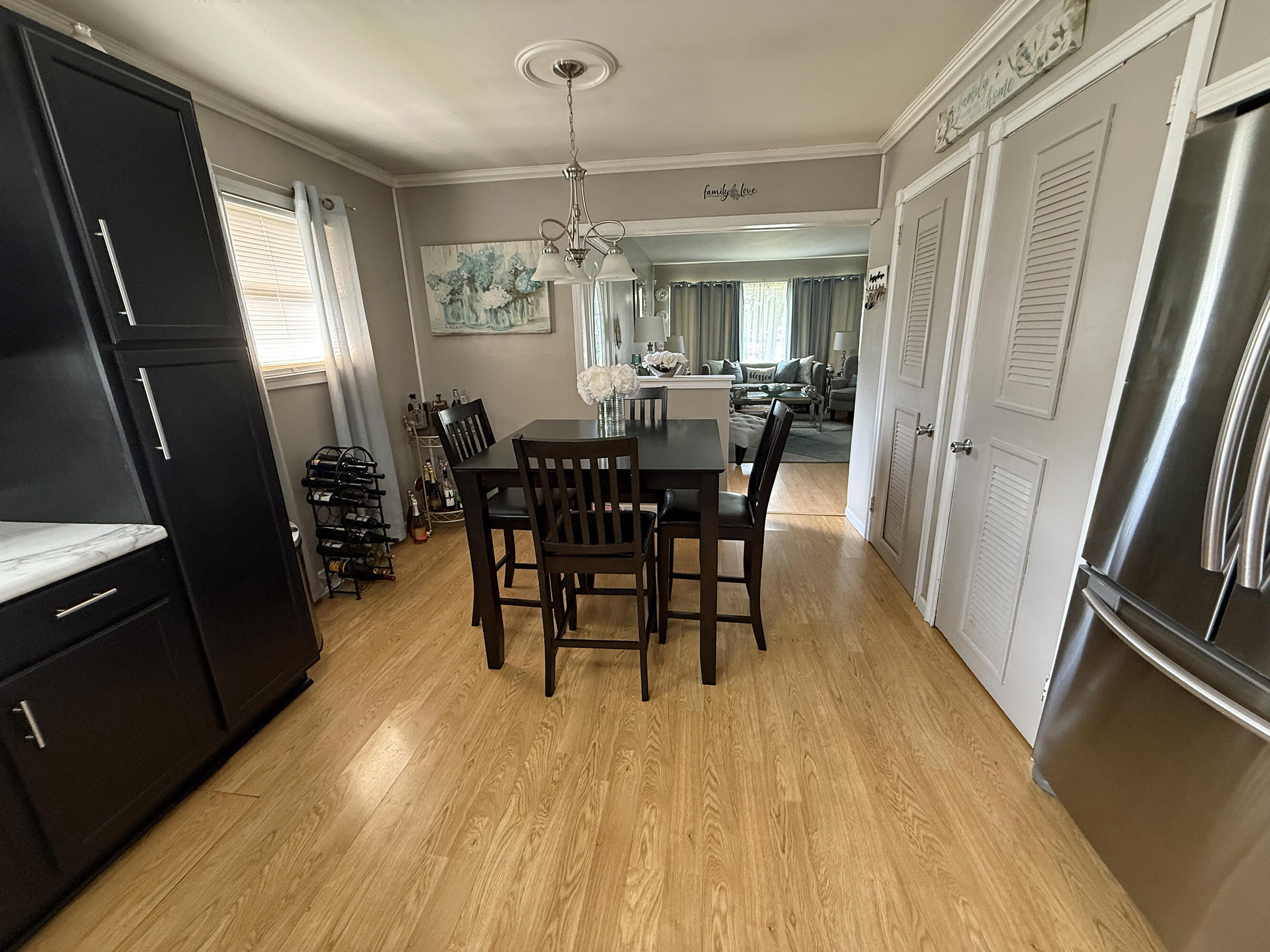 3718 173rd Court Hammond, IN 46323 - Photo 11 of 30 a view of a dining room with furniture window and wooden floor