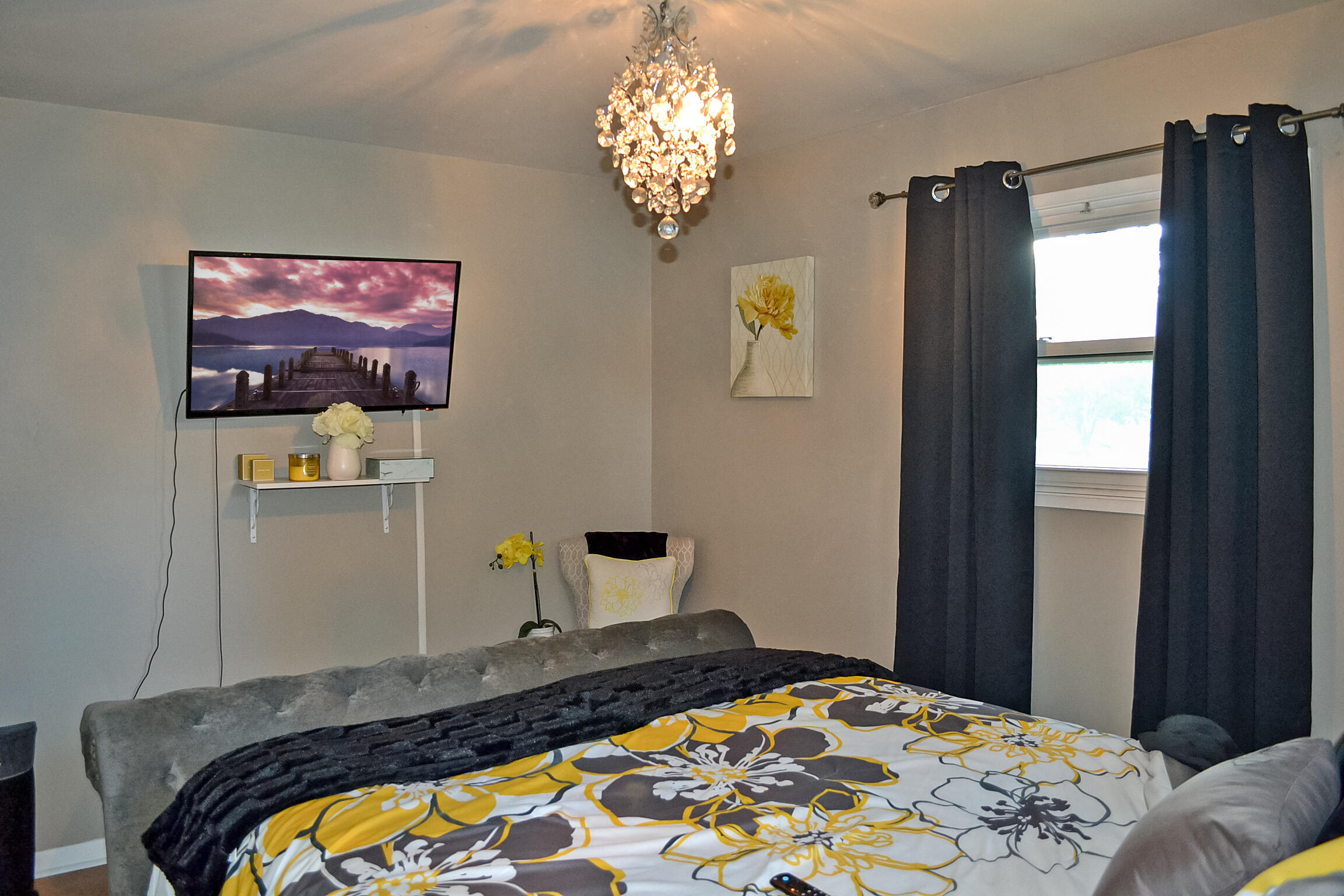 3718 173rd Court Hammond, IN 46323 - Photo 14 of 30 a bedroom with a bed and a chandelier