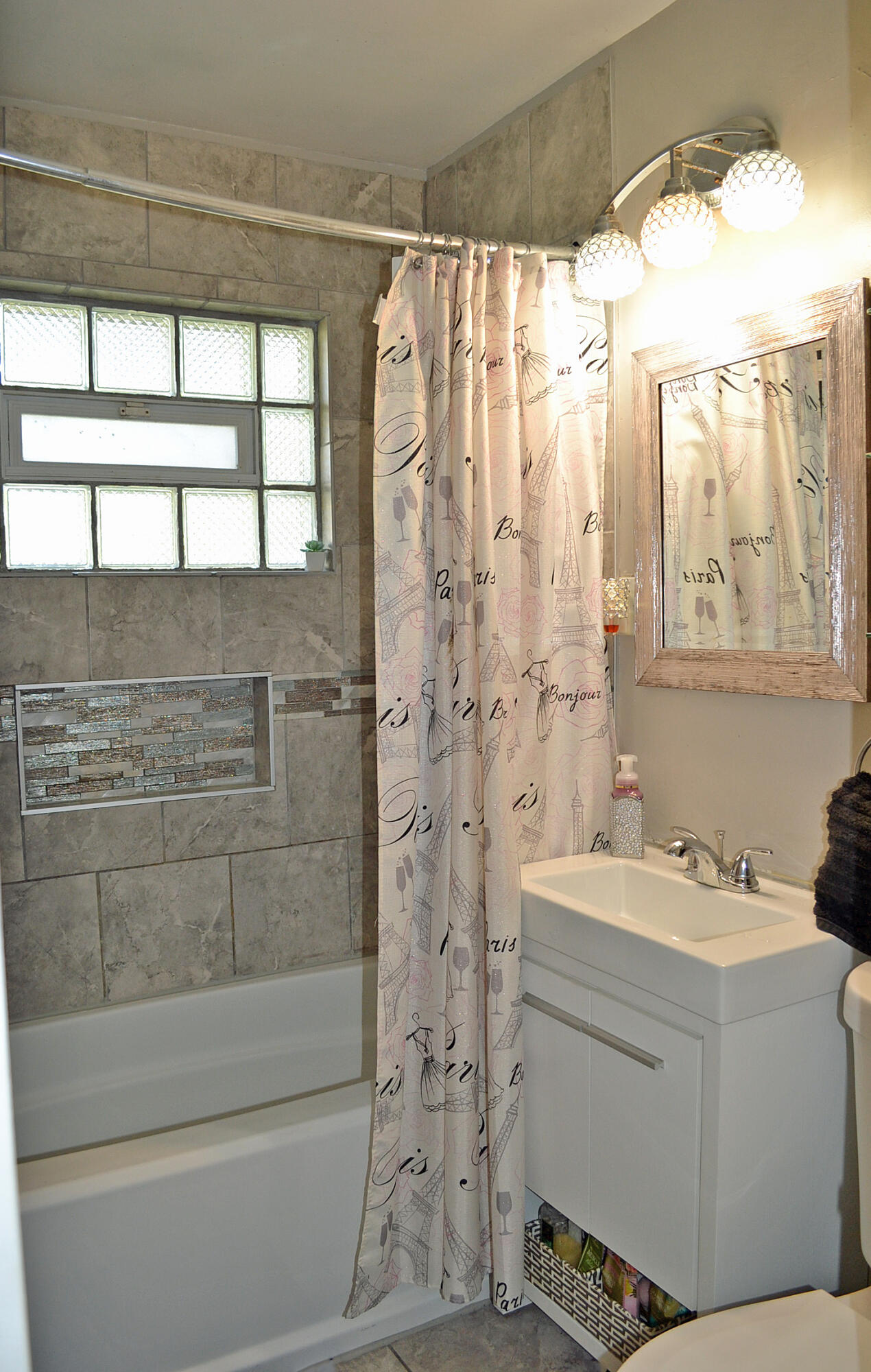 3718 173rd Court Hammond, IN 46323 - Photo 22 of 30 a bathroom with a sink a toilet and shower