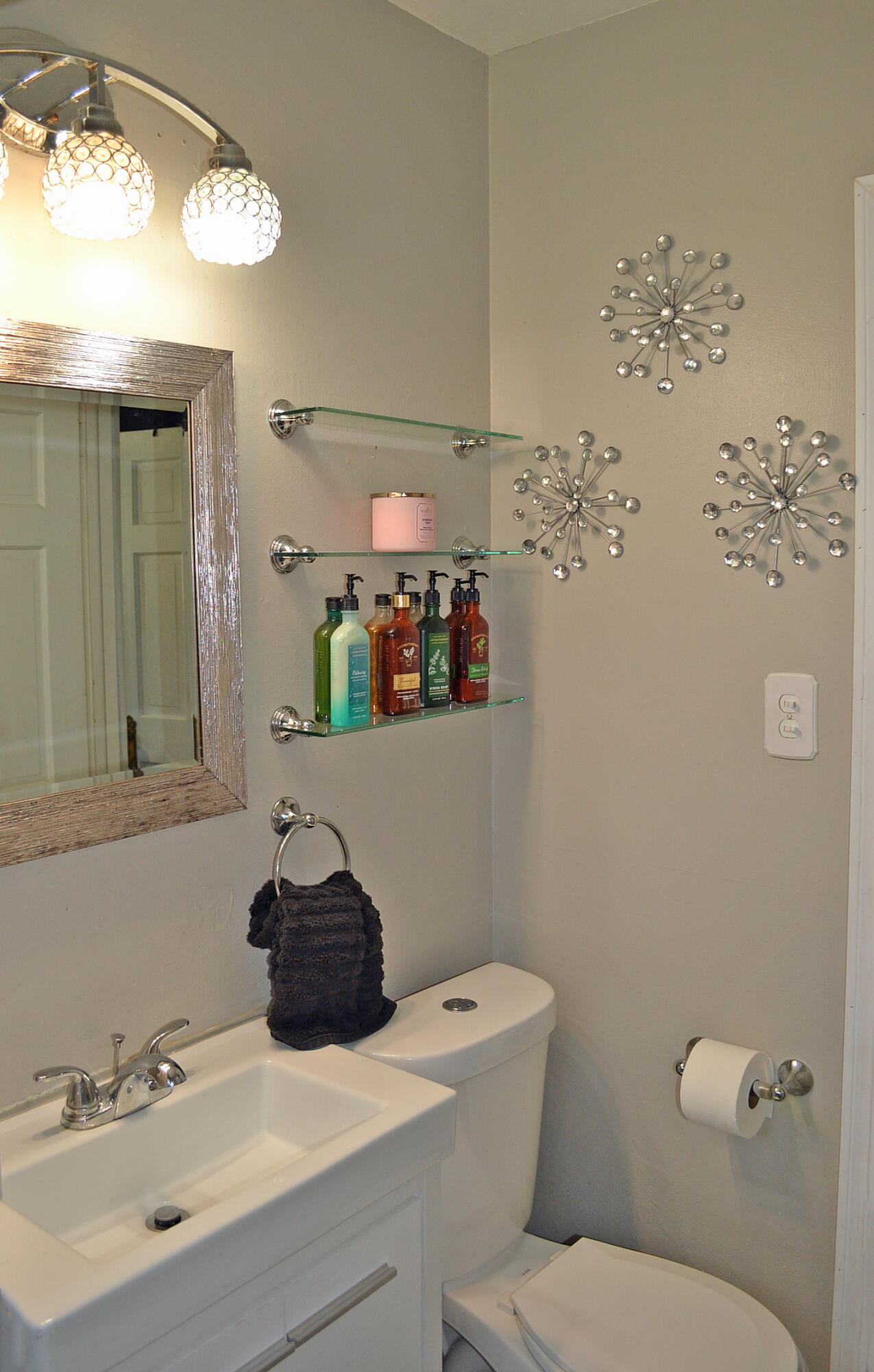 3718 173rd Court Hammond, IN 46323 - Photo 23 of 30 a bathroom with a sink mirror vanity and toilet