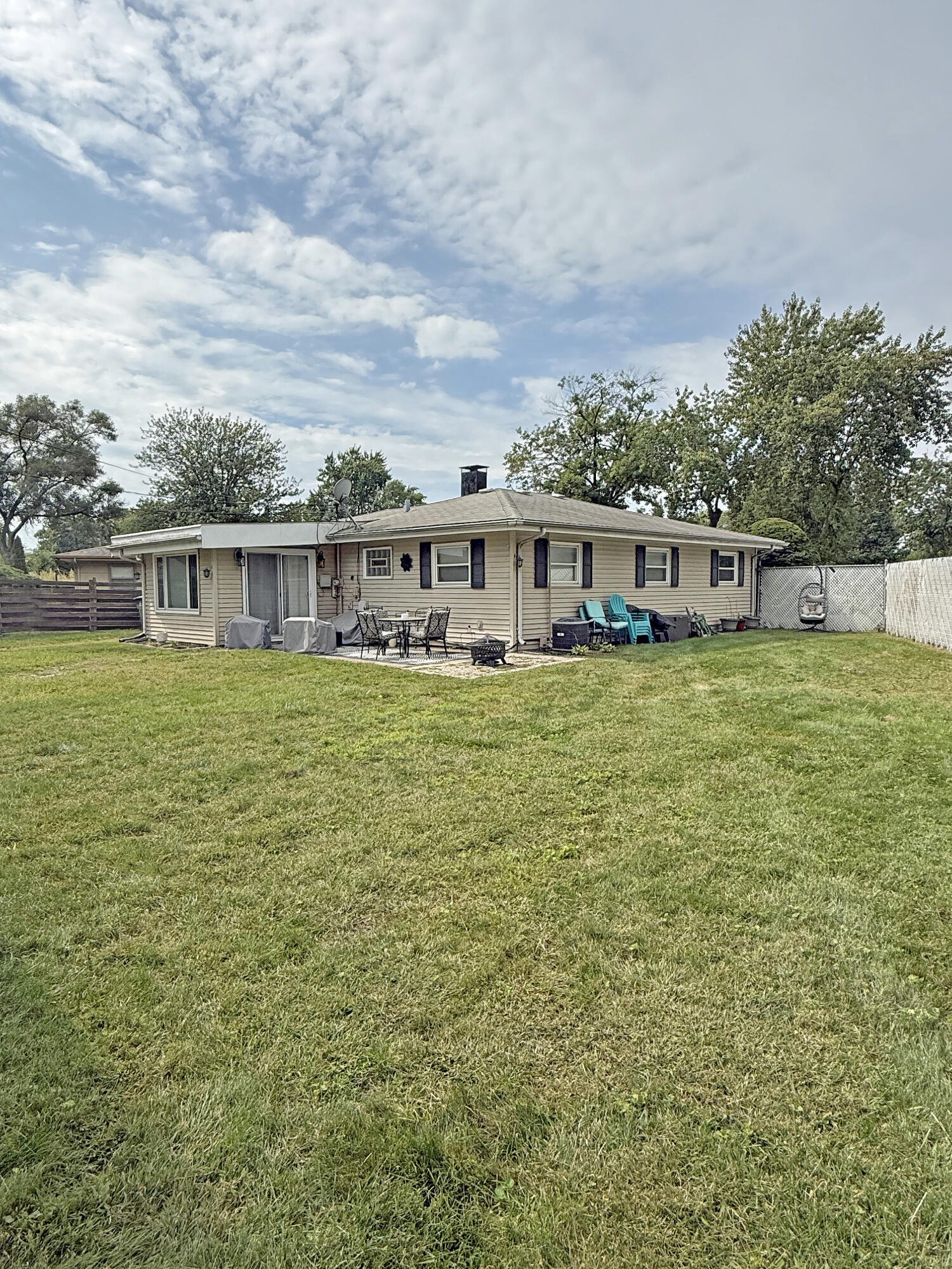 3718 173rd Court Hammond, IN 46323 - Photo 29 of 30 a view of a house with yard and sitting area
