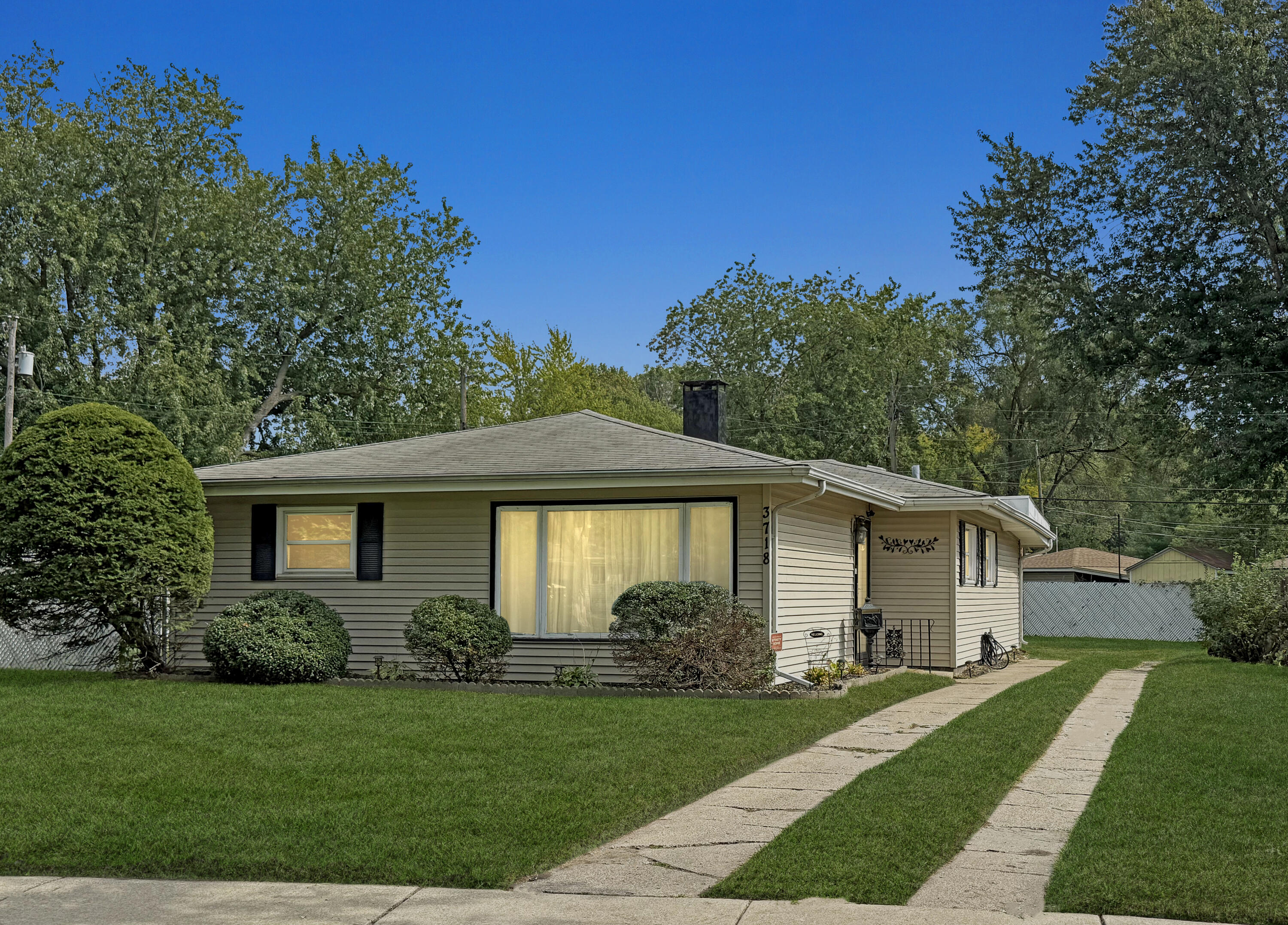 3718 173rd Court Hammond, IN 46323 - Photo 30 of 30 a front view of a house with a garden