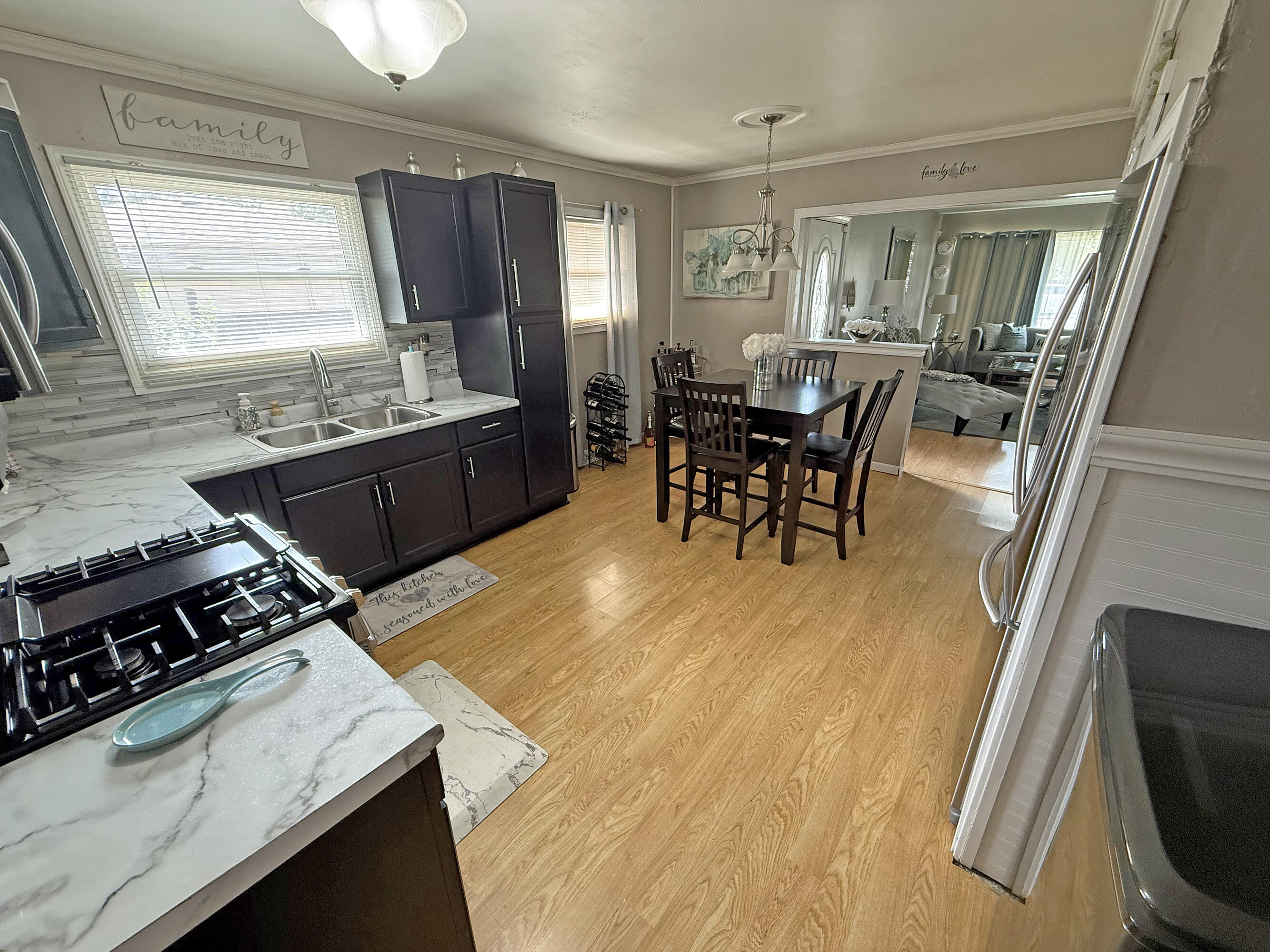 3718 173rd Court Hammond, IN 46323 - Photo 9 of 30 a kitchen with a stove and a table