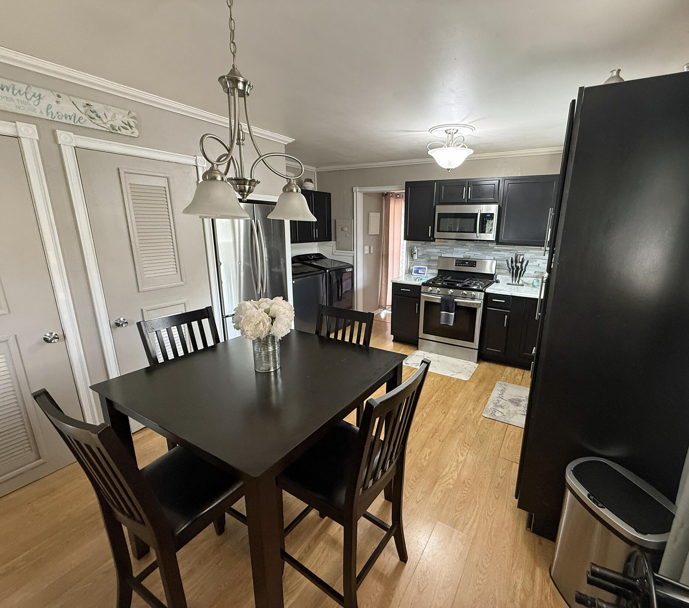 3718 173rd Court Hammond, IN 46323 - Photo 10 of 30 a view of a dining room with furniture and wooden floor