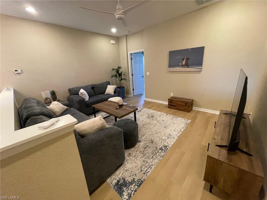 20013 Larino Loop Estero, FL 33928 - Photo 13 of 35 a living room with furniture