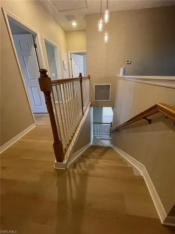 a view of an empty room with stairs