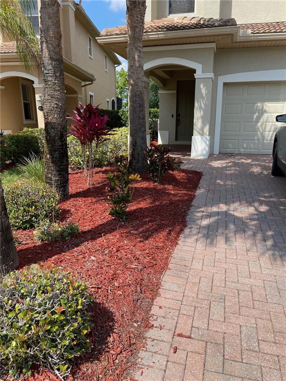 20013 Larino Loop Estero, FL 33928 - Photo 2 of 35 a view of a house with potted plants