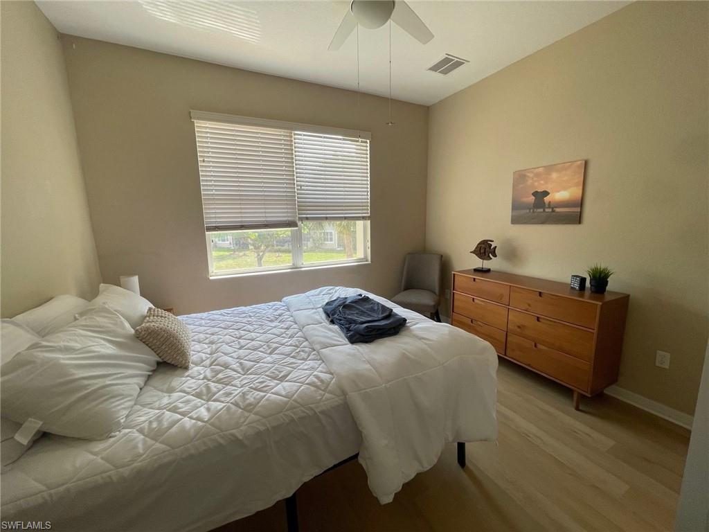 20013 Larino Loop Estero, FL 33928 - Photo 24 of 35 a bedroom with a bed and a window