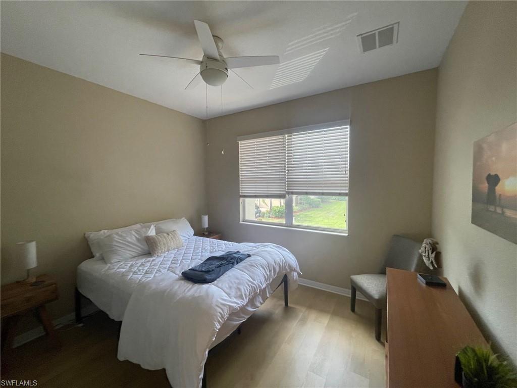 20013 Larino Loop Estero, FL 33928 - Photo 25 of 35 a bedroom with a bed and a window