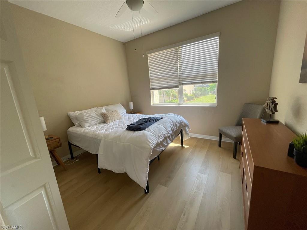 20013 Larino Loop Estero, FL 33928 - Photo 26 of 35 a bedroom with a bed and a window