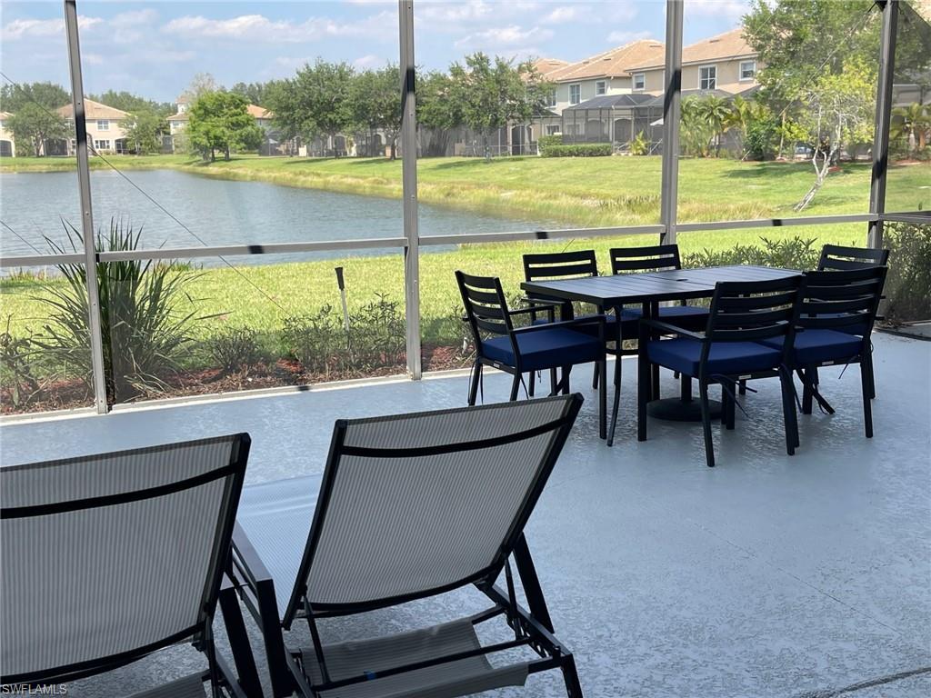20013 Larino Loop Estero, FL 33928 - Photo 31 of 35 a view of an ocean from a dining room with a table and chairs