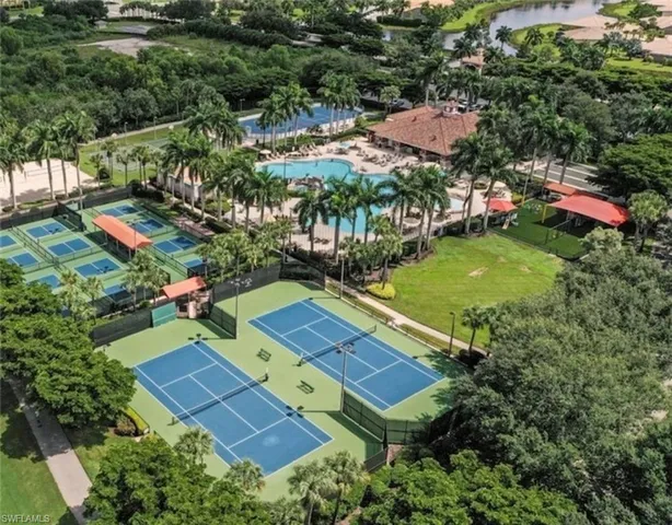 an aerial view of a residential houses with outdoor space and street view