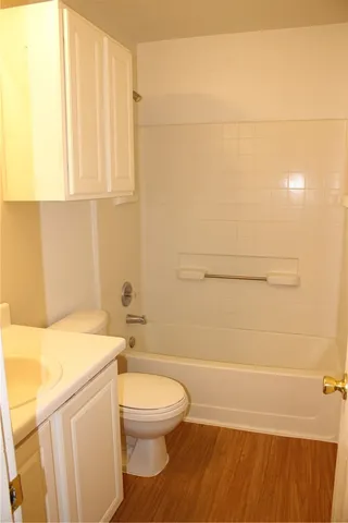 a bathroom with a toilet a sink and a bathtub