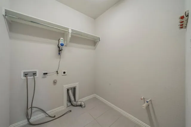 a front view of a house with yard and green space