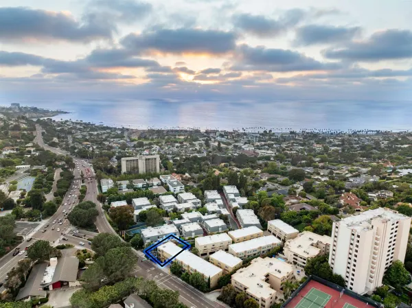 an aerial view of a city with lots of residential buildings
