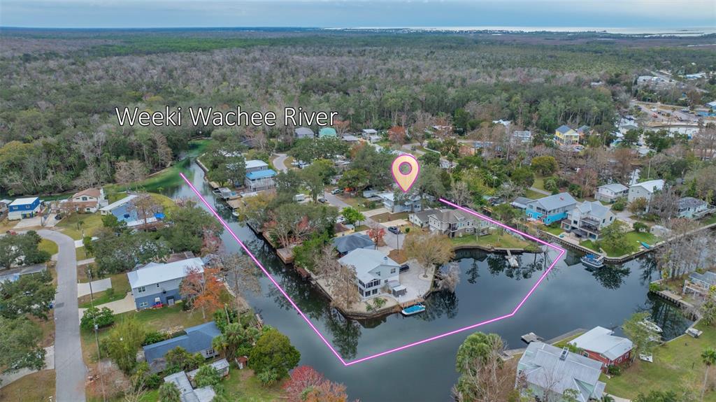 5553 Darlene Street Weeki Wachee, FL 34607 - Photo 1 of 1 an aerial view of a house a yard with an outdoor seating