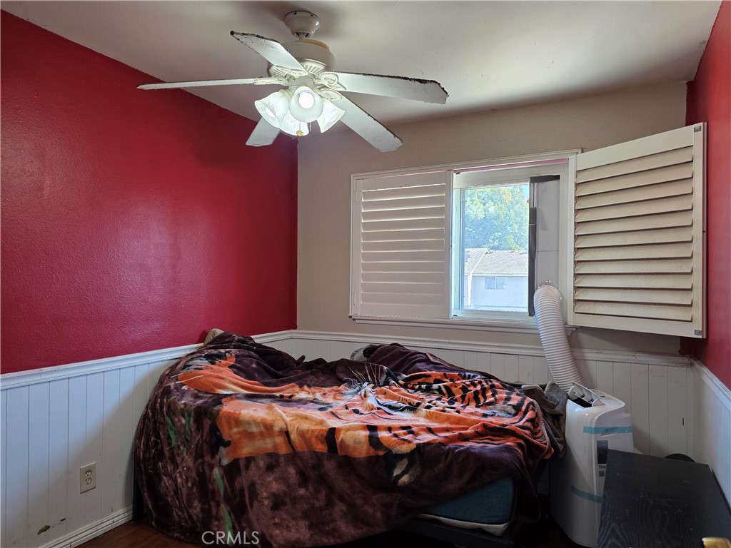 11219 Hood Way Stanton, CA 90680 - Photo 14 of 21 a bedroom with a bed and a chandelier