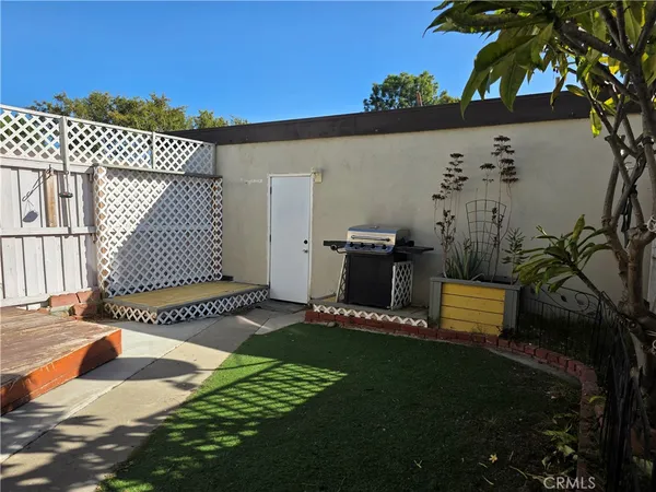 a view of a backyard with sitting area