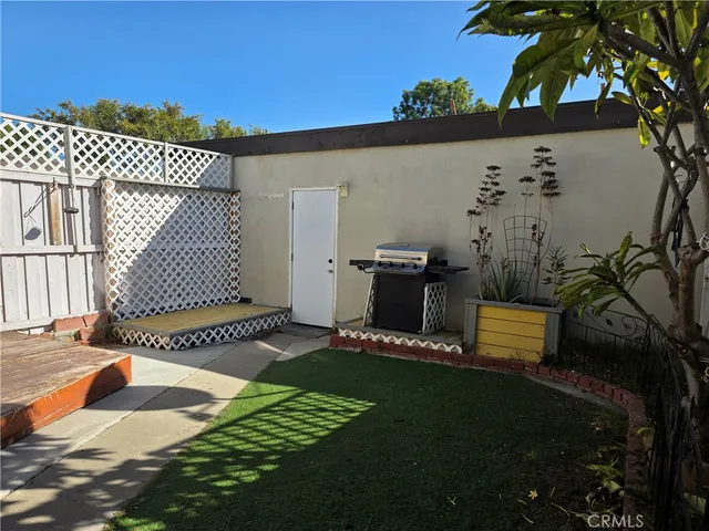 a view of a backyard with sitting area