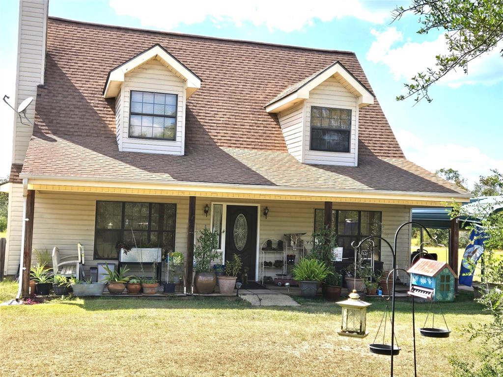 a view of a house with outdoor seating area