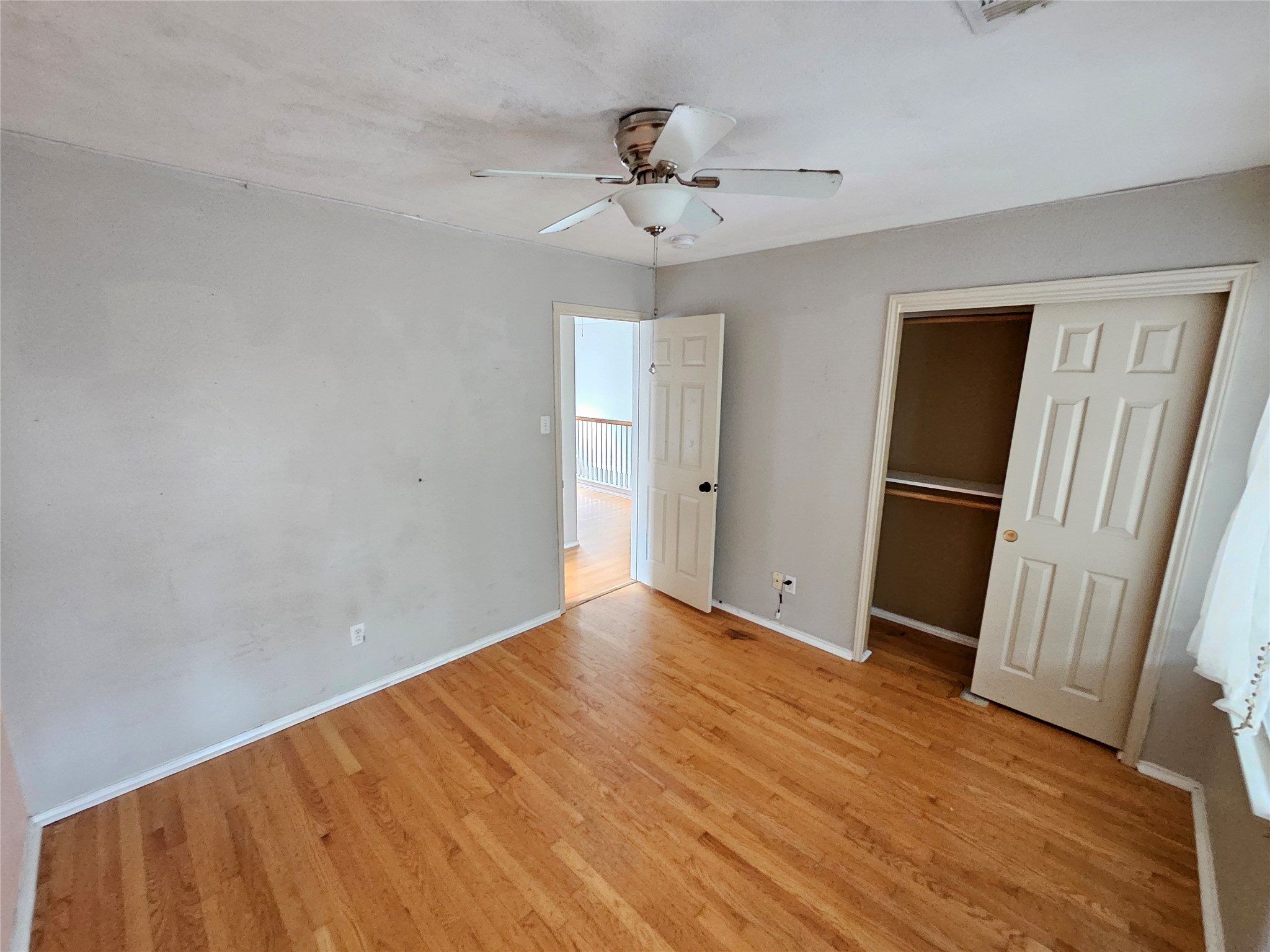 4672 Mather Kyle, TX 78640 - Photo 21 of 28 wooden floor in an empty room with a window