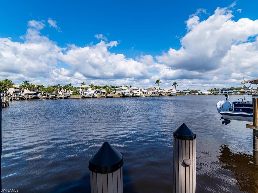 111 Morning Star Cay Naples, FL 34114 - Photo 28 of 47 a view of a lake and outdoor space