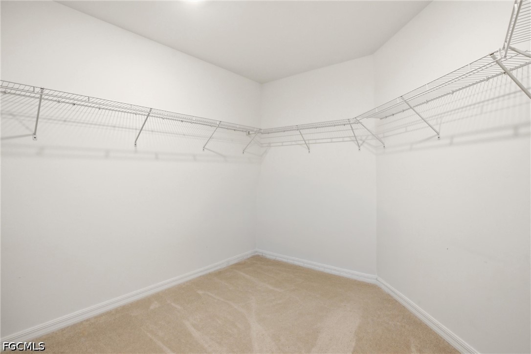 3751 Pebblebrook Ridge Court, Unit 101 Fort Myers, FL 33905 - Photo 22 of 48 a view of a room with racks on the wall
